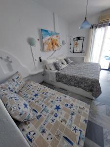 Vuode tai vuoteita majoituspaikassa Doron Hotel Delfini