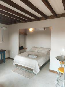Una cama o camas en una habitación de EcoFlats Caraiva