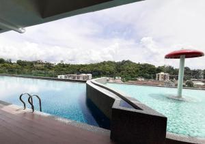 a swimming pool on the roof of a building at T STAY at Icon Residence -for 1 Room Free Netflix & Pool in Kuala Terengganu