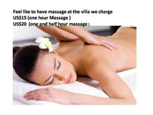 a woman is laying on a towel in a spa at Selog Villa 4 in Seminyak