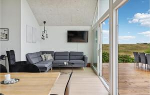 A seating area at Beach Front Home In Ebeltoft With Kitchen