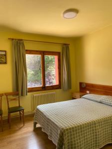 Posteľ alebo postele v izbe v ubytovaní Hostal Alt Llobregat