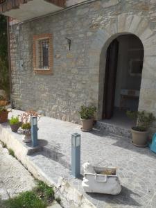 an entrance to a stone building with an archway at LUCIA HOME CASA VACANZE in Santa Maria del Molise