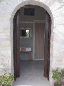 an archway leading into a room with a television at LUCIA HOME CASA VACANZE in Santa Maria del Molise