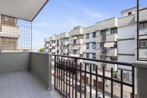 an apartment balcony with a view of a building at Casa Giovanna by Wonderful Italy in Bari