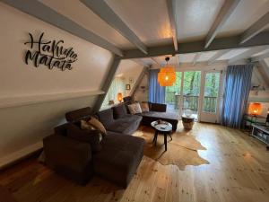 a living room with a couch and a table at Chalet 139 Hakuna Matata in Durbuy