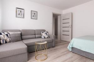 Ένα ή περισσότερα κρεβάτια σε δωμάτιο στο Apartamenty Marinet