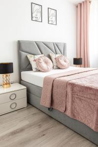 Ένα ή περισσότερα κρεβάτια σε δωμάτιο στο Apartamenty Marinet