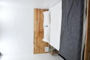 a bedroom with a bed and a mirror at Hotel Regency in Amrāvati