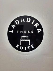 a sign on a ceiling with the words kindness stress cure at ladadikathess in Thessaloniki