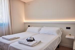 Postel nebo postele na pokoji v ubytování Ancón Suites