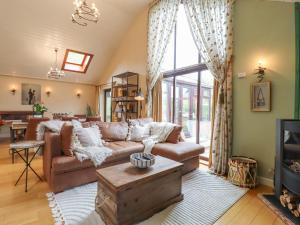 a living room with a couch and a tv at 256 London Road in Colchester