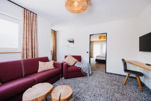 a living room with a couch and a table at Gasthof Schützenhof in Flachau