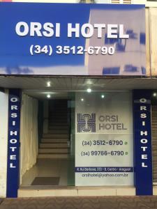 a sign in the window of a hotel at ORSI HOTEL in Araguari