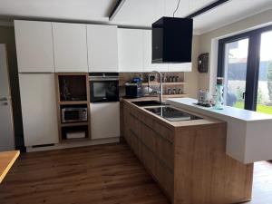 Kuchyň nebo kuchyňský kout v ubytování Heidis Ferienwohnung