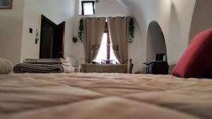 Postel nebo postele na pokoji v ubytování La Locanda di Nonno Paolo