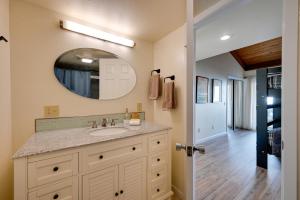a bathroom with a sink and a mirror at Hot Tub and Ocean Views Spacious Irish Beach Home! in Manchester +23 photos