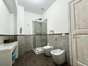 a bathroom with a shower and a toilet and a sink at Il Gioiello a Palau in Palau +31 photos