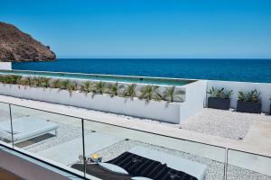 a view of the ocean from the balcony of a house at Ancón Suites in Carboneras