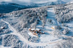 an aerial view of a resort in the snow at El Refugio Ski & Summer Lodge in San Martín de los Andes