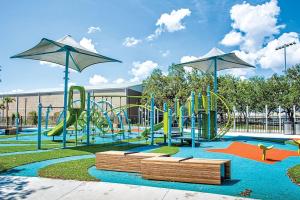 a park with a playground with a slide at The Pearl Cottage 2b/1R with King and FAST WIFI in Tampa