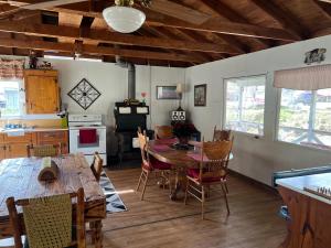 a kitchen and dining room with a table and chairs at Rolling Brook Inn in Maggie Valley +33 photos