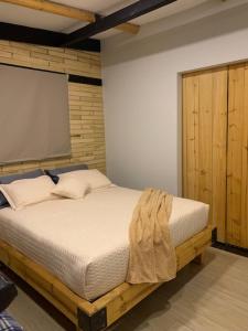 Postel nebo postele na pokoji v ubytování Casa de Campo Xiua Laguna d Fúquene