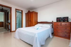 Кровать или кровати в номере Casa de alto padrão a 400 metros da praia brava