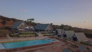 an aerial view of a house with a swimming pool at Outback Kenya Lodge in Athi River