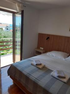 Postel nebo postele na pokoji v ubytování Apartments Mare