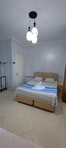 Postel nebo postele na pokoji v ubytování Hotel Ergo