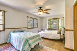 a bedroom with two beds and a ceiling fan at Sparrow Bush Retreat with Fireplace and Screened Porch in Sparrow Bush