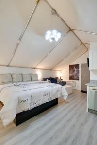 a bedroom with a large bed in a tent at 12 Launch Pad Luxury Glamping Tent Space Theme in Scottsboro