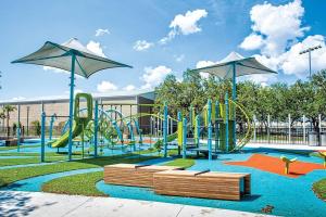 a park with a playground with a slide at Newly Renovated Couple’s Retreat 2Bd/1B with King Bed in Tampa