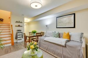 a living room with a couch and a table at Downtown Baltimore Vacation Rental WFH Friendly! in Baltimore