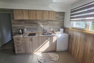Kuchyň nebo kuchyňský kout v ubytování Calm Nest