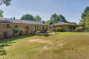 a brick house with a yard in front of it at Pet-Friendly Rex Vacation Rental 18 Mi to Atlanta in Rex