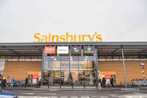 a sainsburys store with people walking in front of it at Spacious Ground Floor Flat in Buckinghamshire