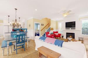 a living room with a white couch and a table at Olivia's Rose in Lincoln City +37 photos