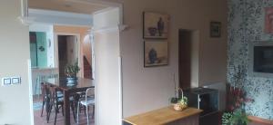 a kitchen and dining room with a refrigerator and a table at Villa ELSA 27286AAXS8 TU986D RITGA-E-2023-05277 in Foz