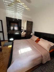 A bed or beds in a room at Unik Private Villa Center