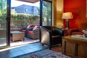 a living room with a patio with chairs and a table at Desert Mermaid in Sedona in Sedona