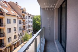 a balcony with a view of a building at City center 1-Bedroom Apartment in Plovdiv