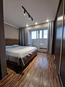 Postel nebo postele na pokoji v ubytování Apartment on Republic Square