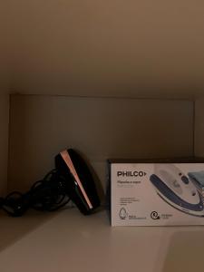 a box sitting next to a wii game controller at DEPTO EN AV ROCA PARA HASTA 4 PERSONAS - Edificio MIRÓ2 in Santiago del Estero