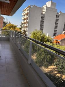 a balcony with a view of some buildings at DEPTO EN AV ROCA PARA HASTA 4 PERSONAS - Edificio MIRÓ2 in Santiago del Estero