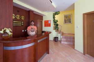 a man standing in the lobby of a hospital at Sunny Flower Family Hotel in Sunny Beach +66 photos