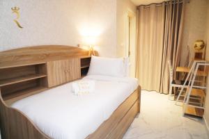 Letto o letti in una camera di Jade Serenity 2BR Urban Hideaway in Oasis