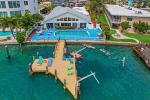 an aerial view of a house with a dock in the water at Dolphin Court #9 in St. Pete Beach