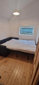 Postel nebo postele na pokoji v ubytování Tinymansion